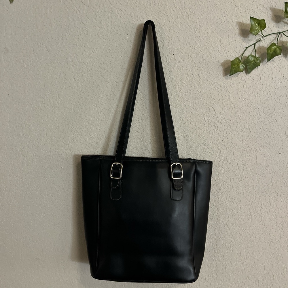 black shoulder tote bag with scratches on front